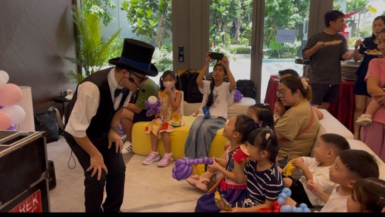 kids magician with the kids in a party